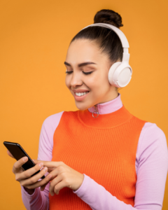 A happy person using the DealMagik app on their smartphone, illustrating the seamless and comprehensive shopping experience.